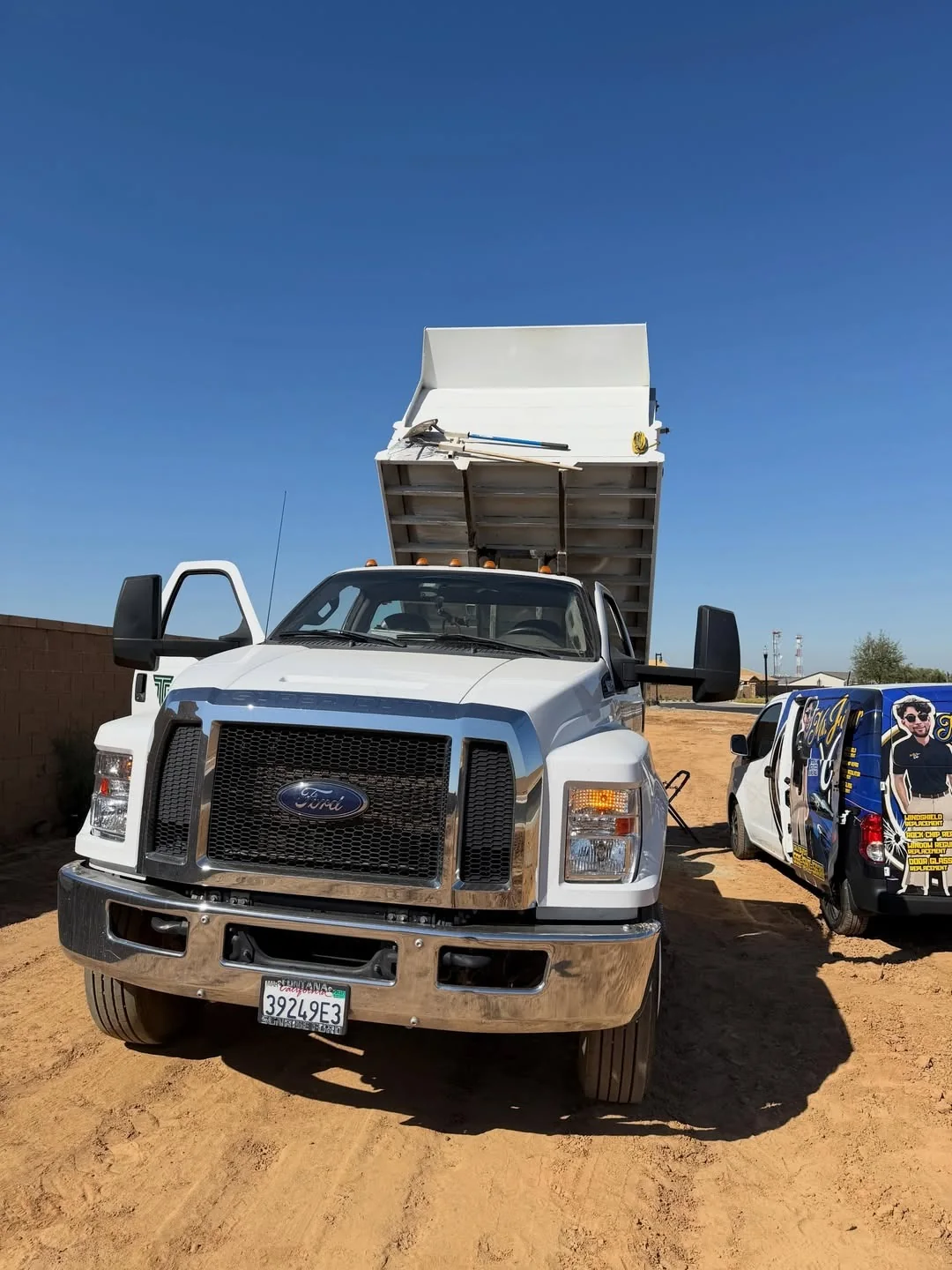 Work truck with the Mr. Fix Your Chip service van nearby