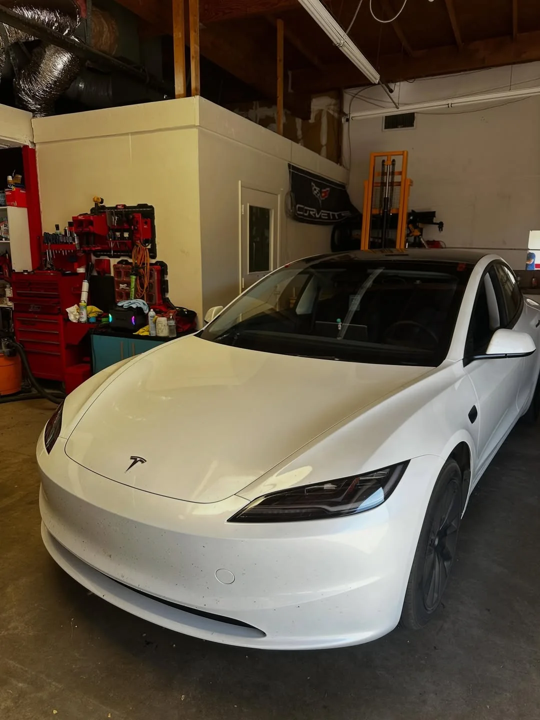 White electric sedan after windshield service