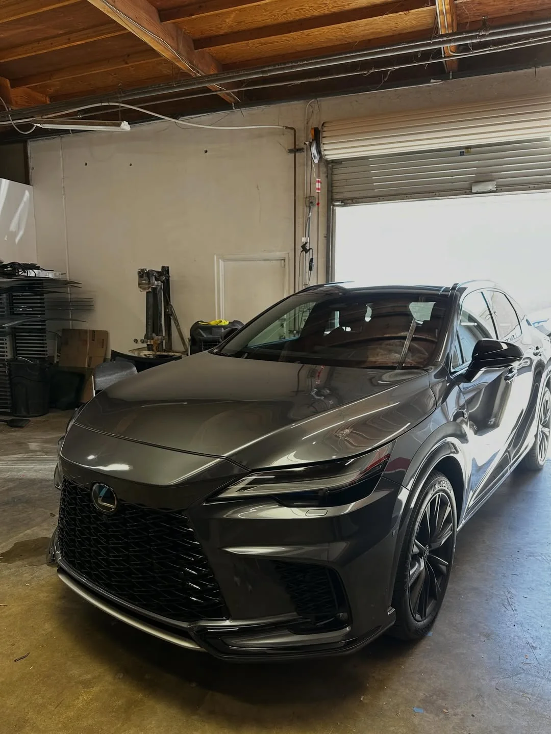 Dark luxury SUV at an auto glass appointment