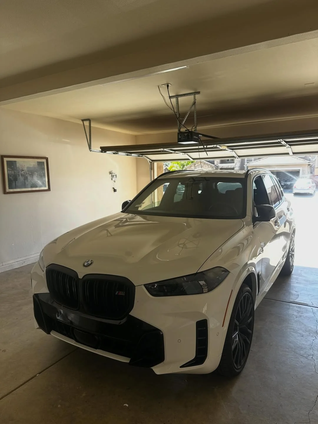 White luxury SUV in a residential garage